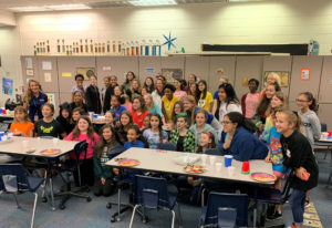 Tatiana stands with a group of girls from the Girls’ Engineering Club.