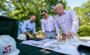 Mike Goodson reviewing construction drawings.