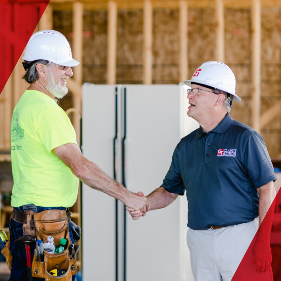 Clancy & Theys employees shaking hands